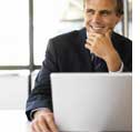 Photograph of person at computer