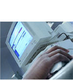 Photo of computer and hand